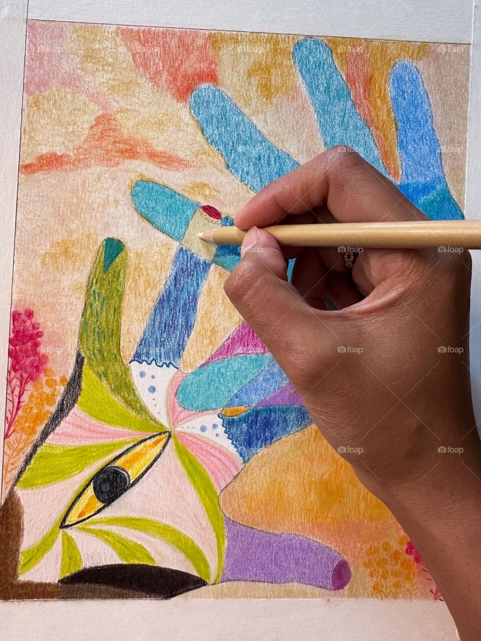 A close up photo of a colorful hand drawing using colored pencil in an abstract art. 