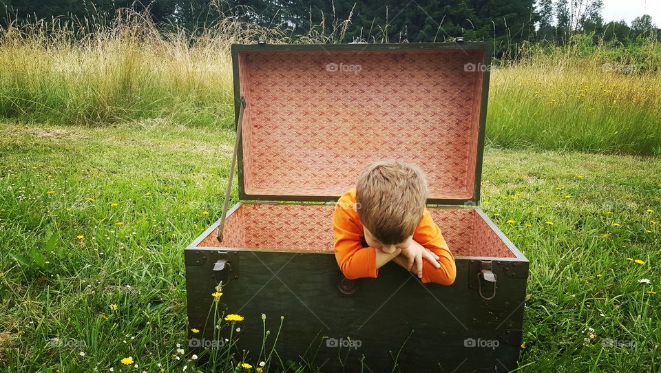 Look mom! I fit in the trunk.