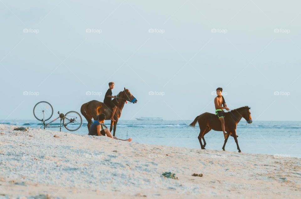 Riding on the beach