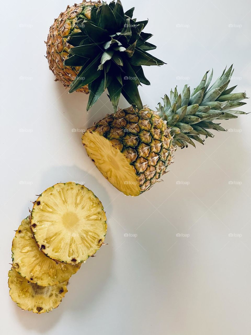 Juicy yellow pineapple slices from above, tropical fruit, Latin American fruit, edible bromeliad 