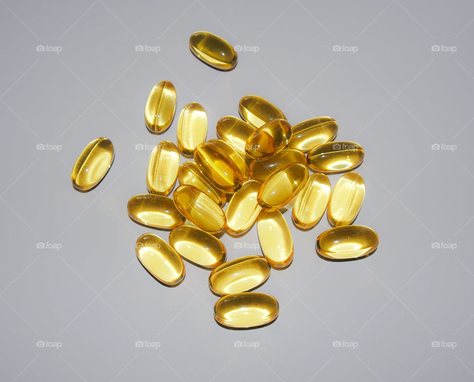 Close-up of gold colored capsule