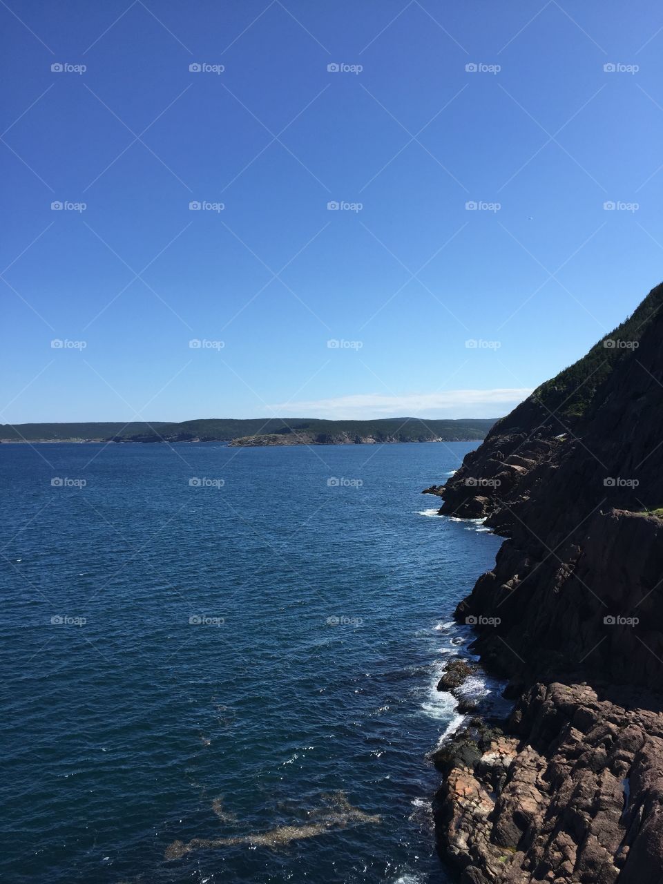 Newfoundland coastline at Fort Amherst just outside St. John's, NL with Cape Spear in the distance. 