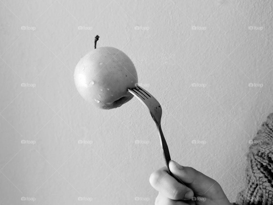 fork with apple.