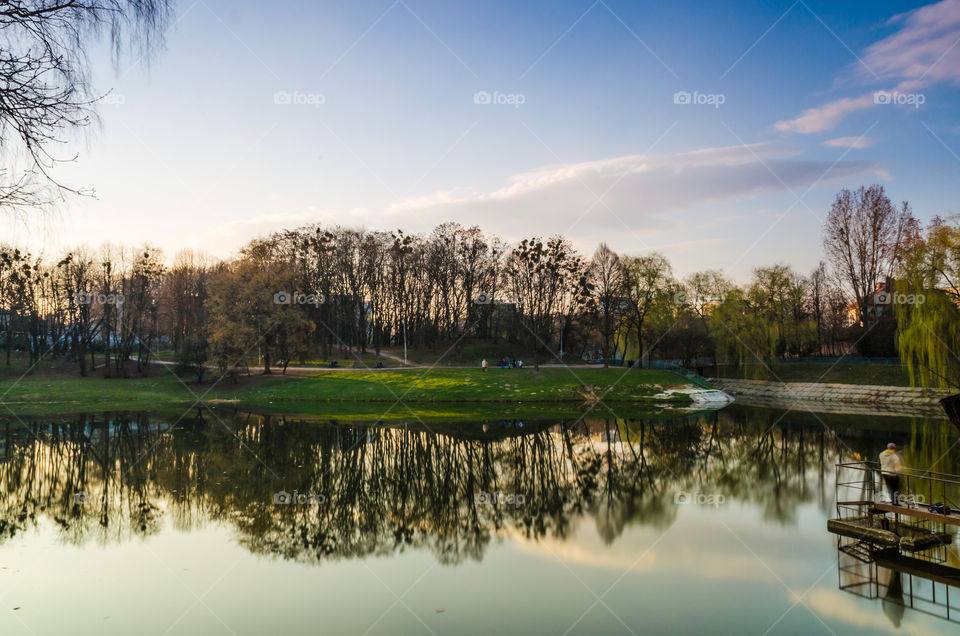 city park with lake in the spring season