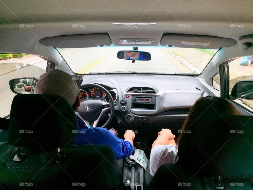 couple driving on the road