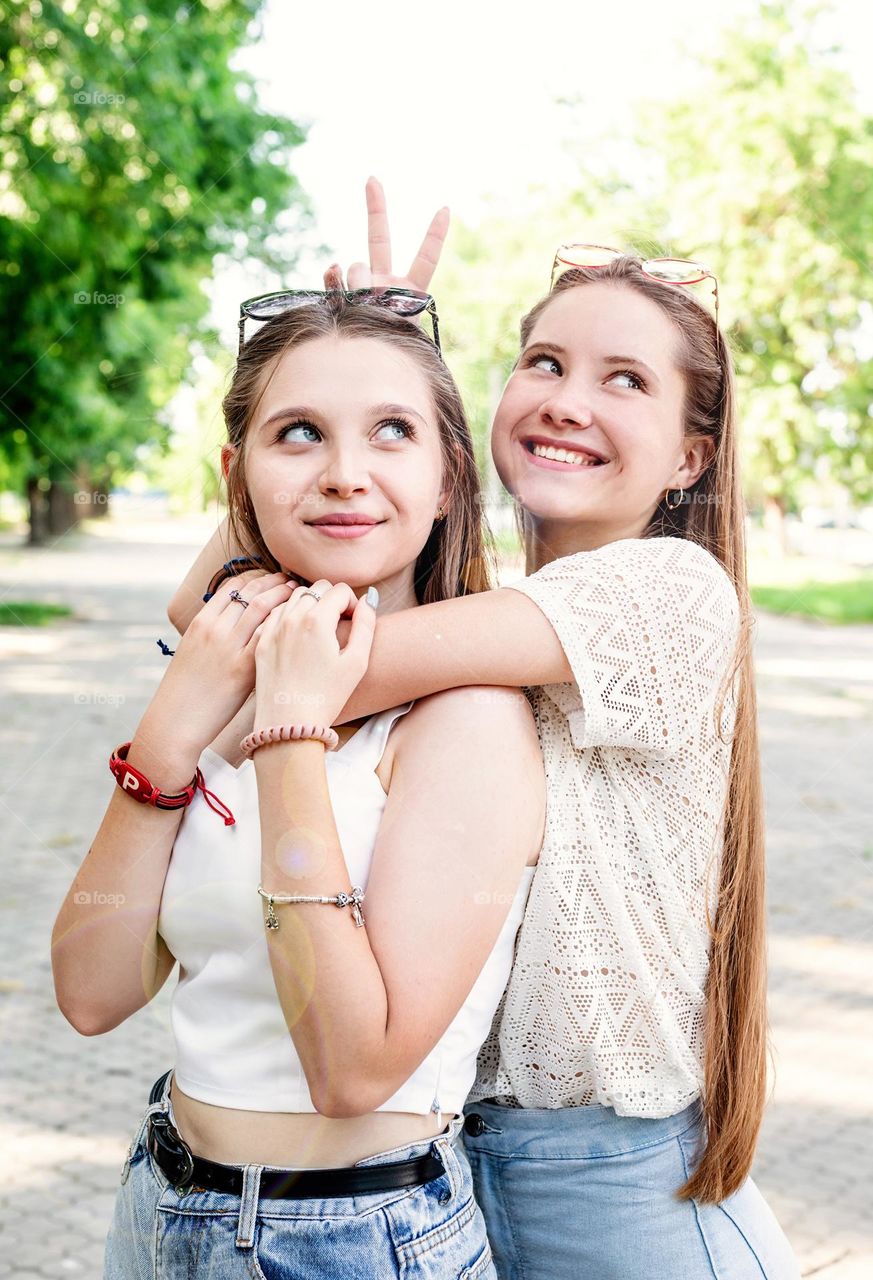 sisters embracing each other