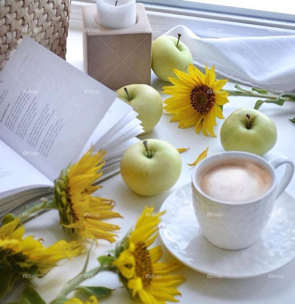 Serve a cup of coffee with flowers and orange slices