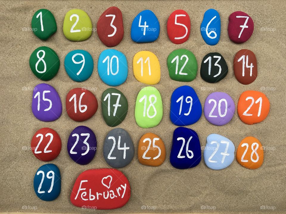 February, calendar on colored stones 