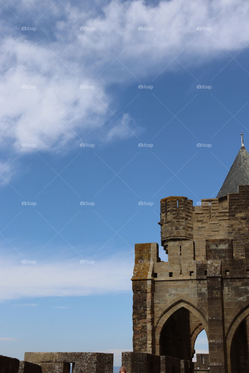 A castle in front of a beautiful blue sky