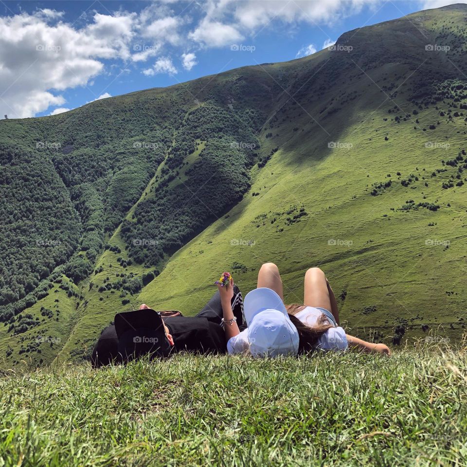 Happy couple hiker enjoying mountain trip, scenery beautiful view 