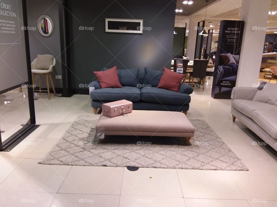 Furniture display sofa indoors seating with cushions and rug