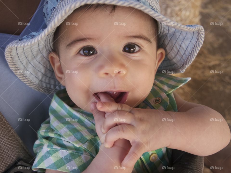 finger in mouth. baby chewing away