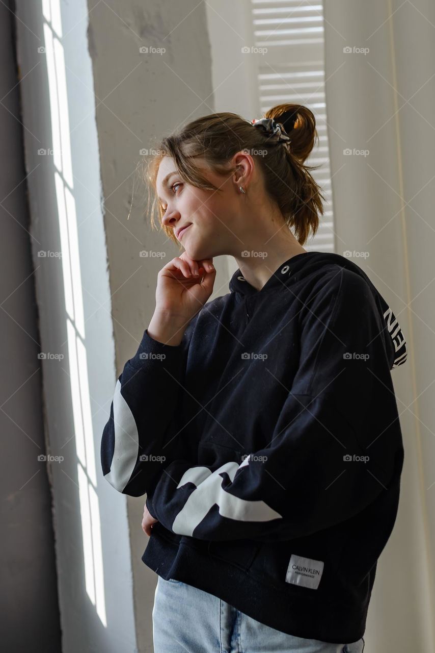 Beautiful woman near the window 