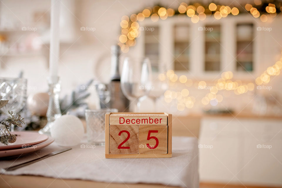 Christmas background with wooden block calendar with the date of December 25