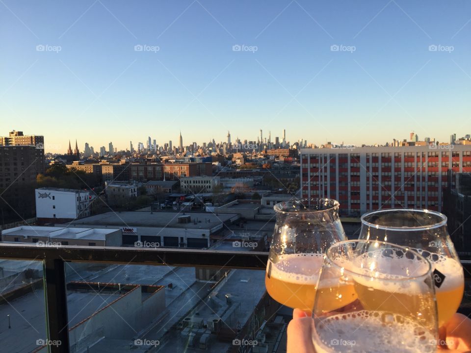 Manhattan skyline with beer glasses