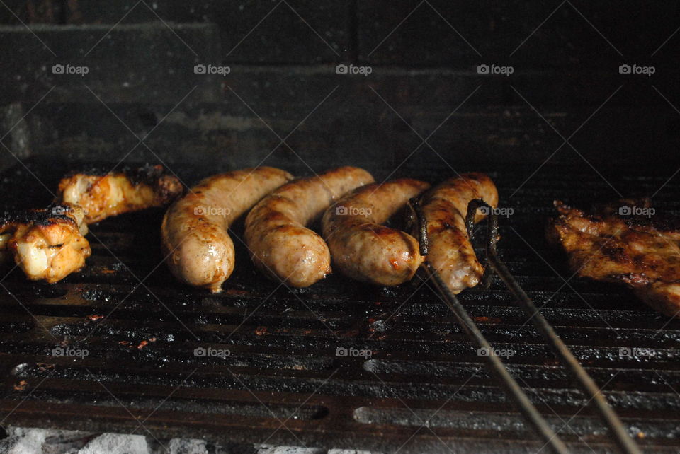 sausages turning bbq