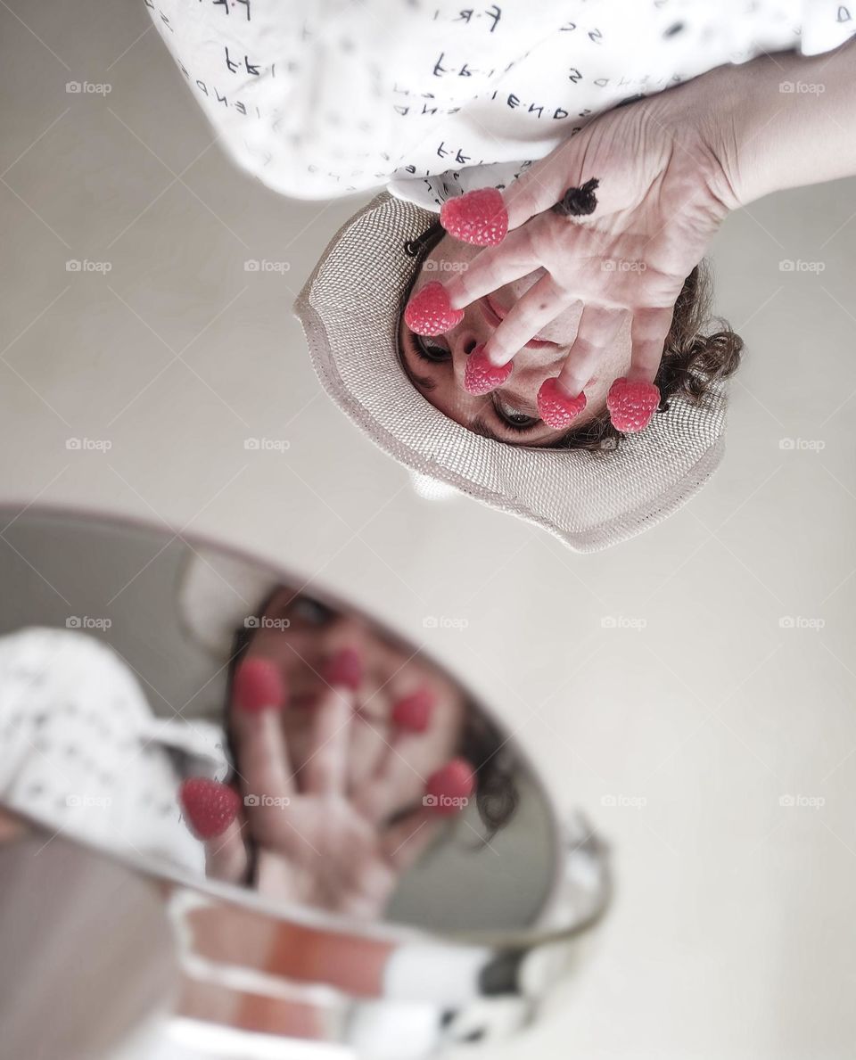 Berries fingers portrait with reflection