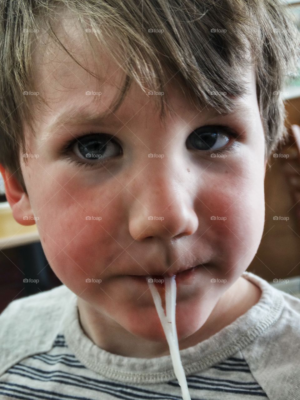 Young Boy Slurping Noodles