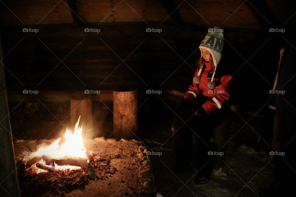 Keeping warm by the fire