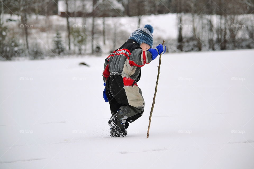 Toddler playing in the snow