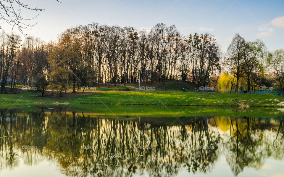 city park with lake in the spring season