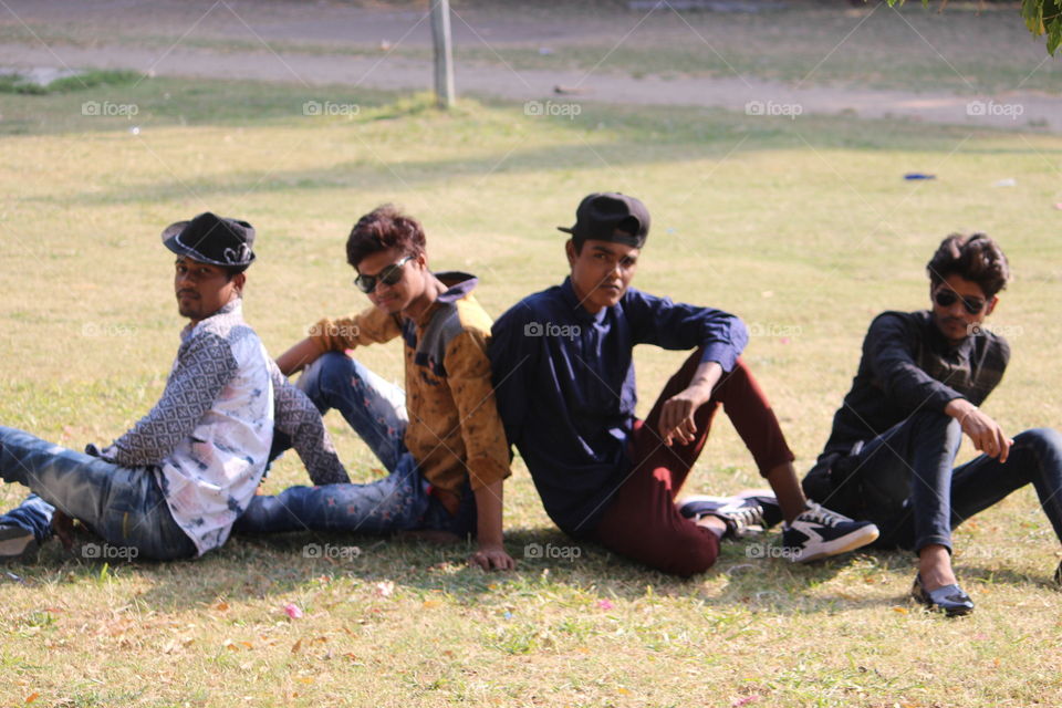 Group of friends sitting on grass