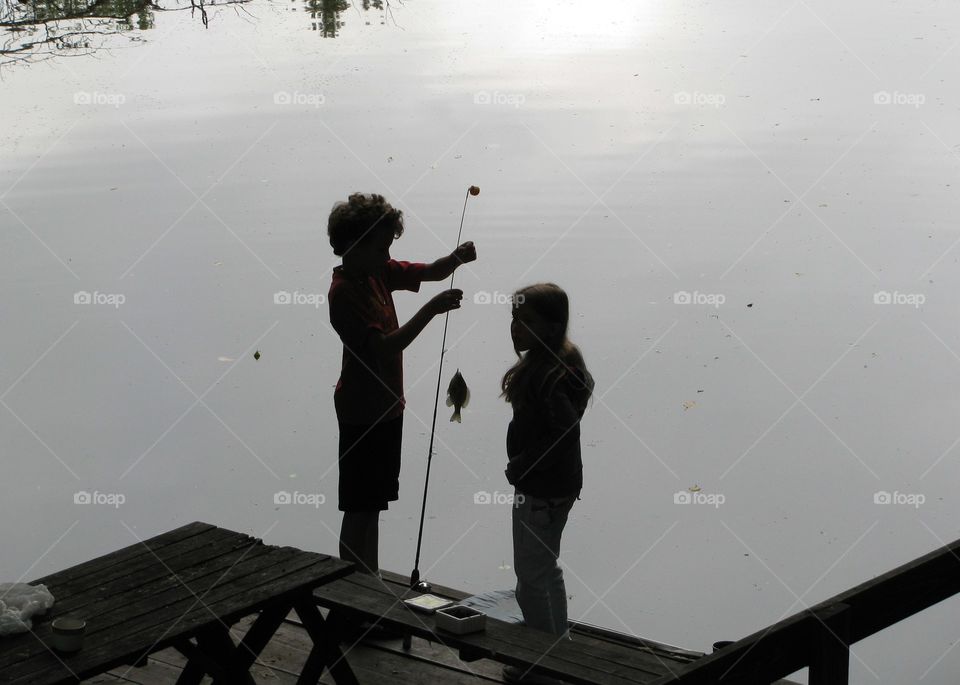 Fishing Buddies- traditional summer family camping trip. My babies would start fishing before the sun came up and until bedtime. Catching bluegill and turtles, but they never gave up on the hope of catching the big one.