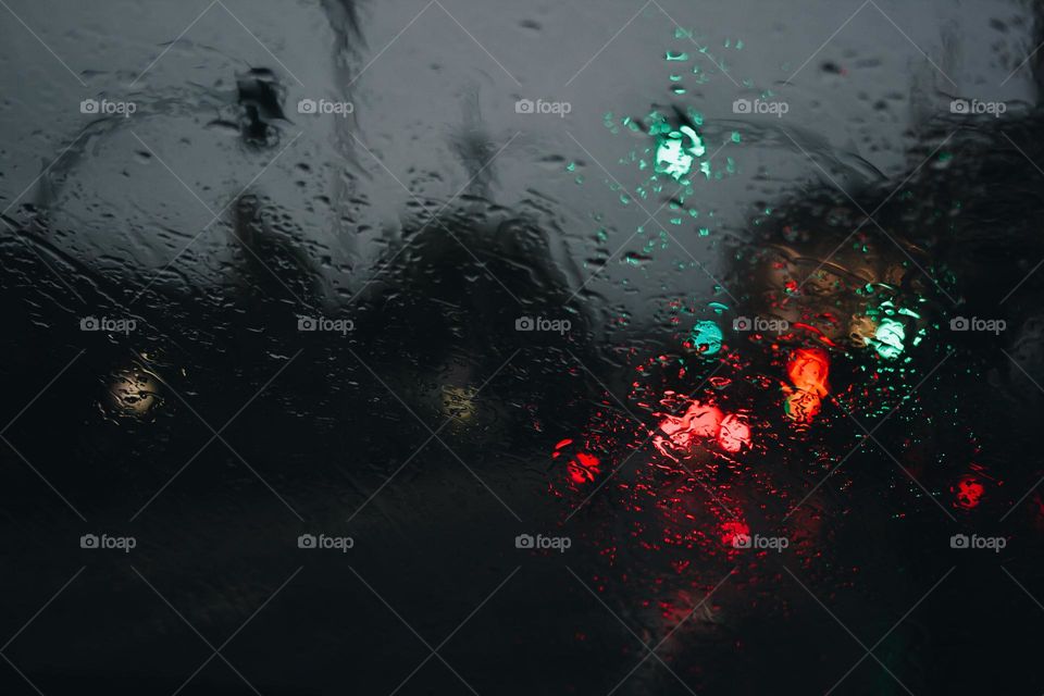 rain creates glass texture on city street