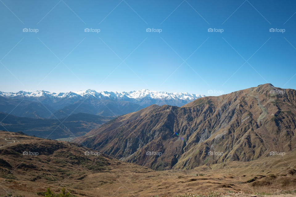 Beautiful mountain scape in front of blue sky background at Georgia countryside