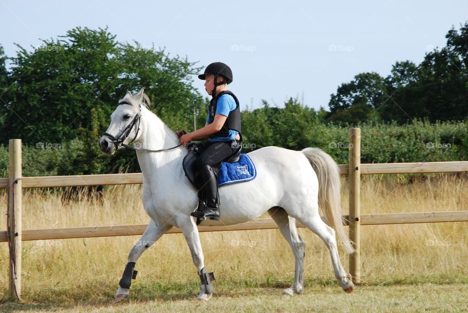 Boy is riding horse