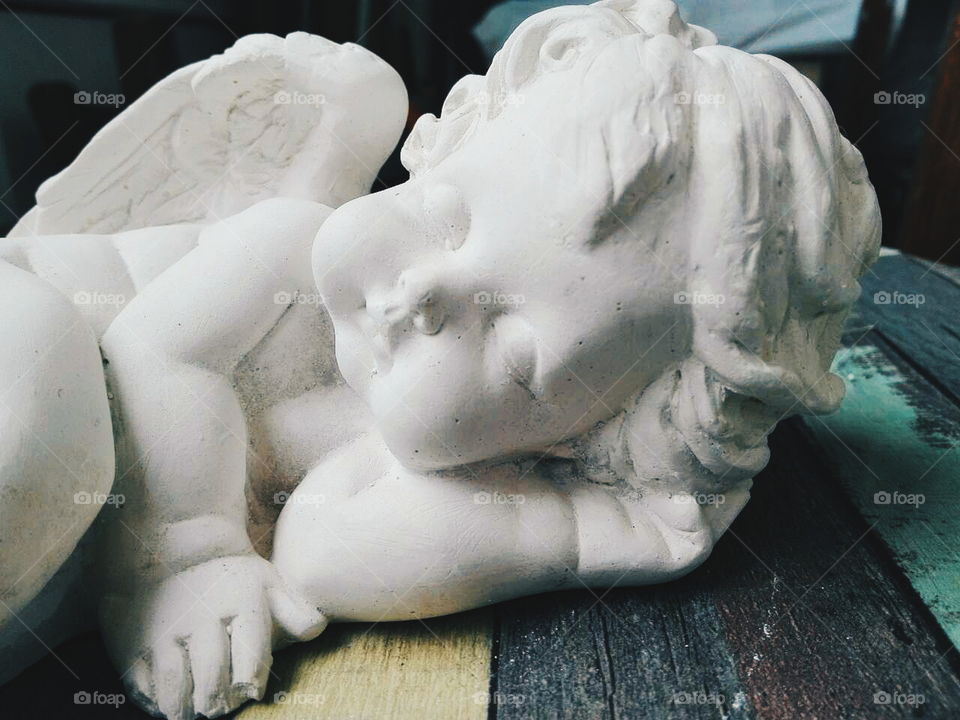 sculpture of a little angel child