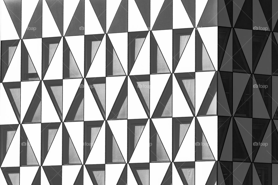 Triangle shaped windows on the building facade 