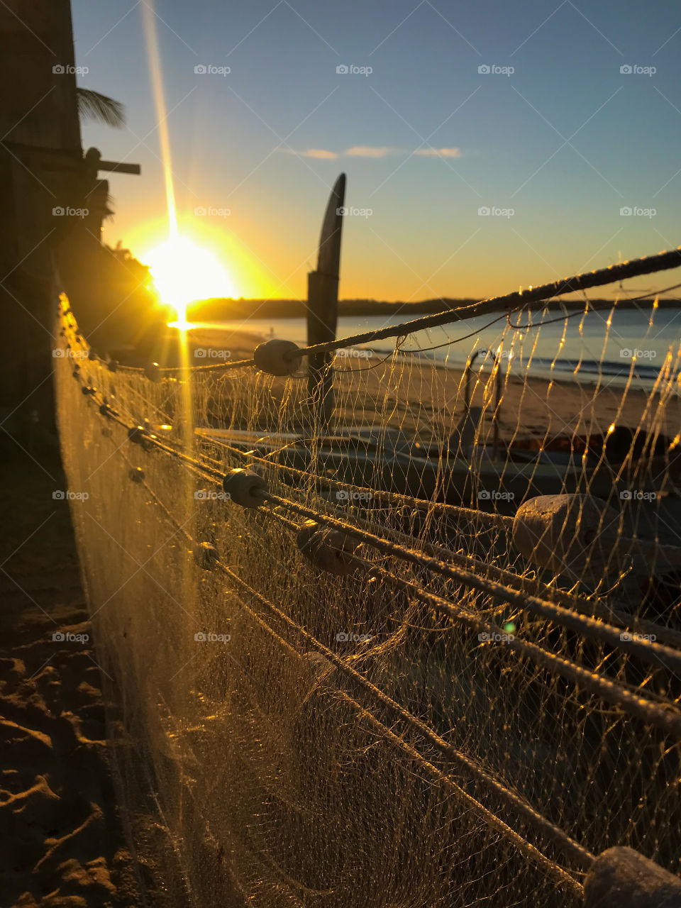 Sunset and this beautiful fishing net.  summer is amazing