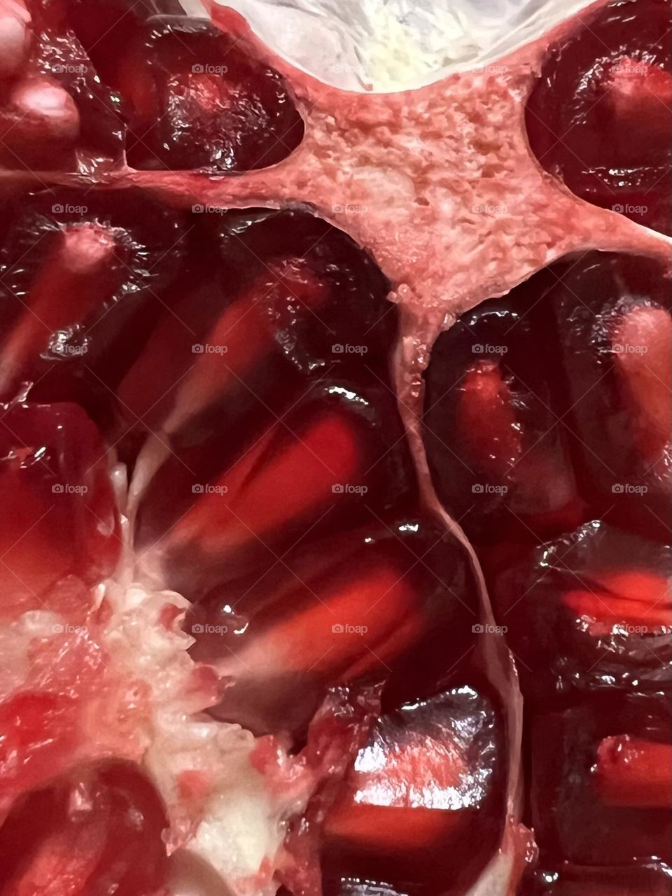 Veggie vs fruit mission. Closeup of a pomegranate and it’s juicy red seeds - used them in a dish the other night!