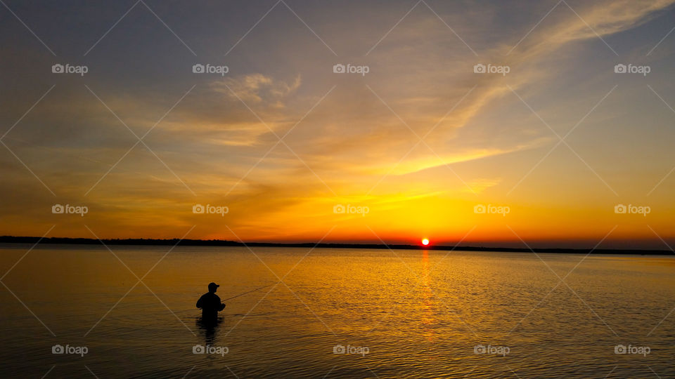 sunset fisherman