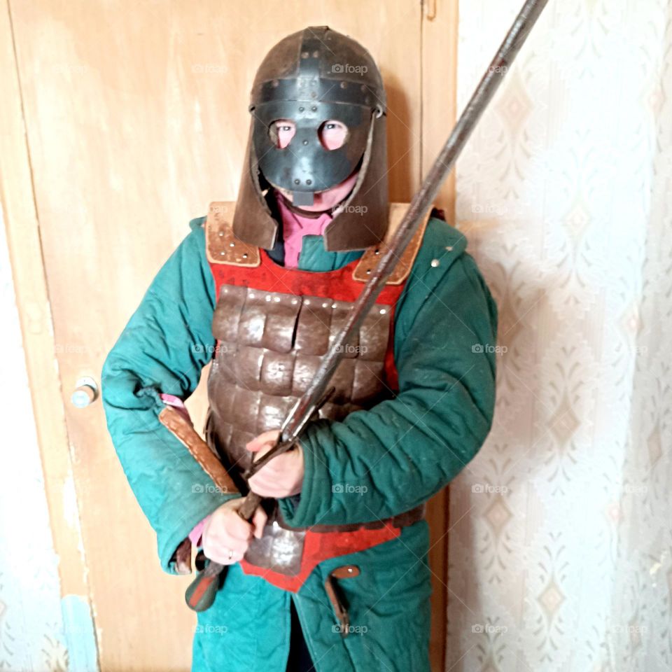 woman in armor and with a sword