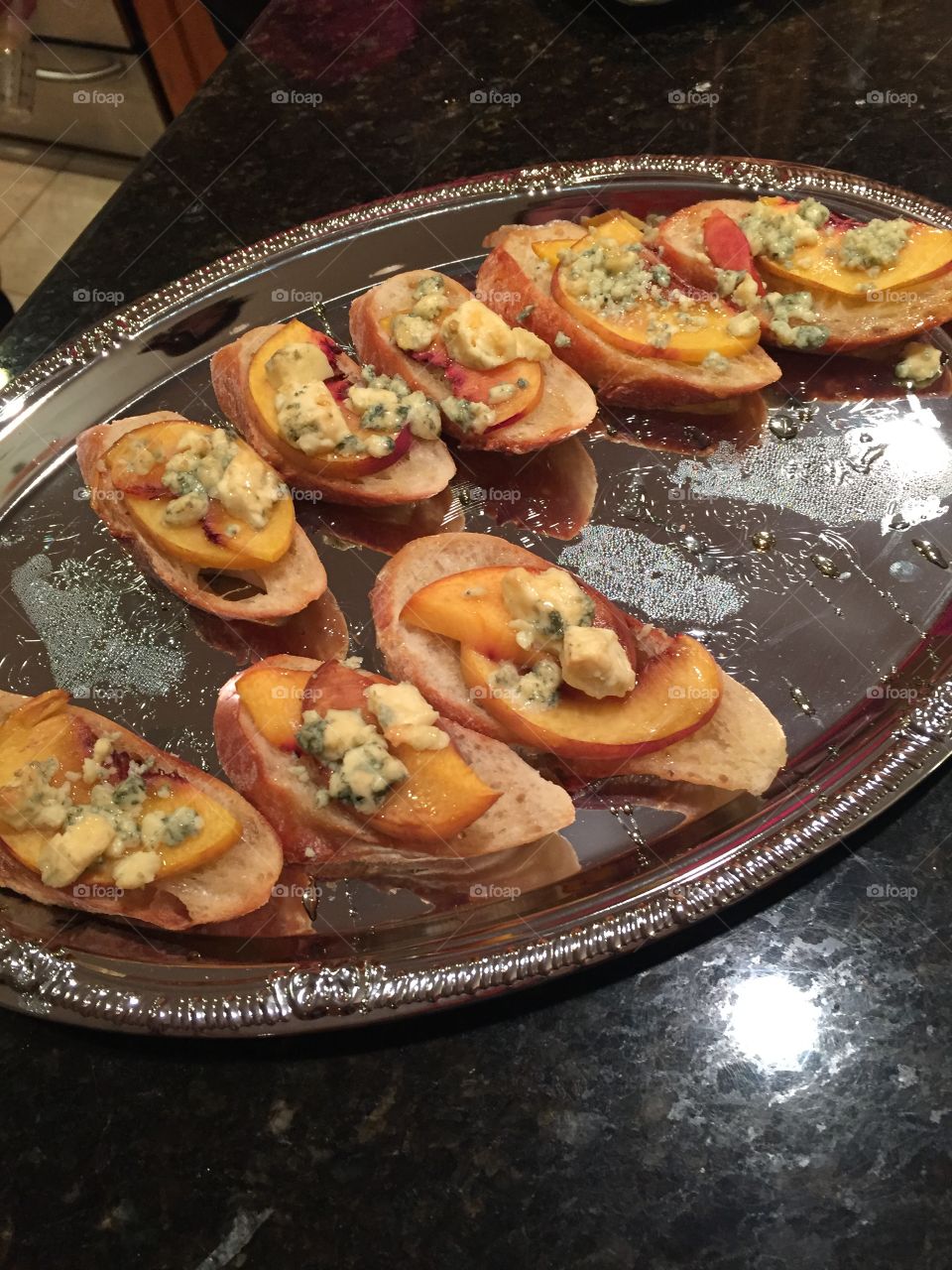 Delicious appetizer. Crostini with peach, Gorgonzola and honey 