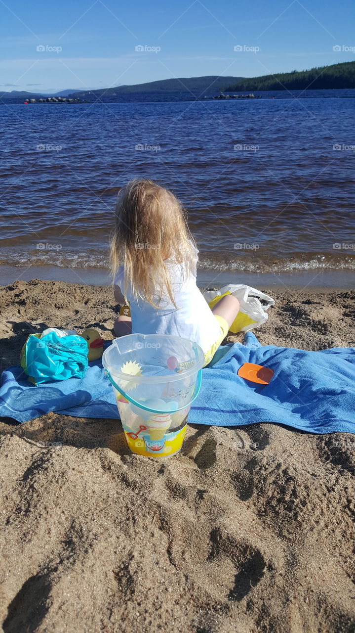 Girl playing on the beach