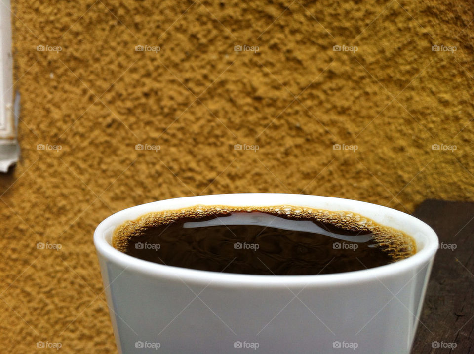 COFFEE OUTSIDE BY HOUSE WALL