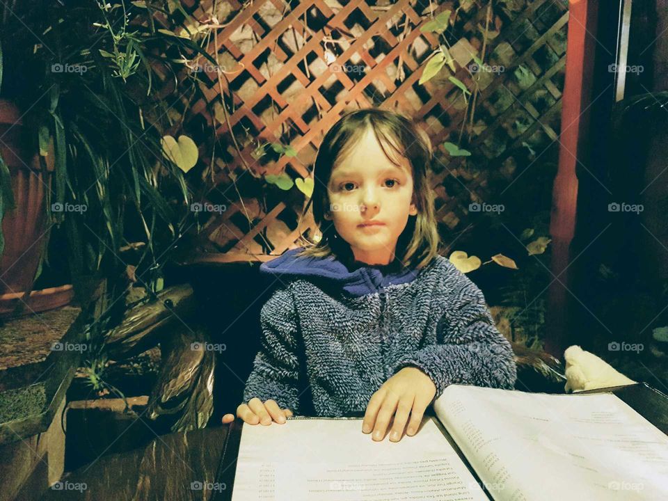 Small girl in a restaurant