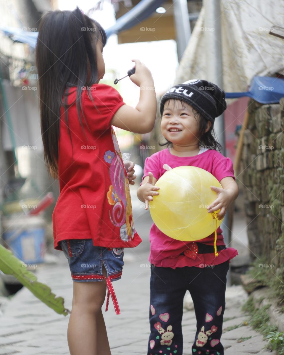 playing with baloon and soap bubble