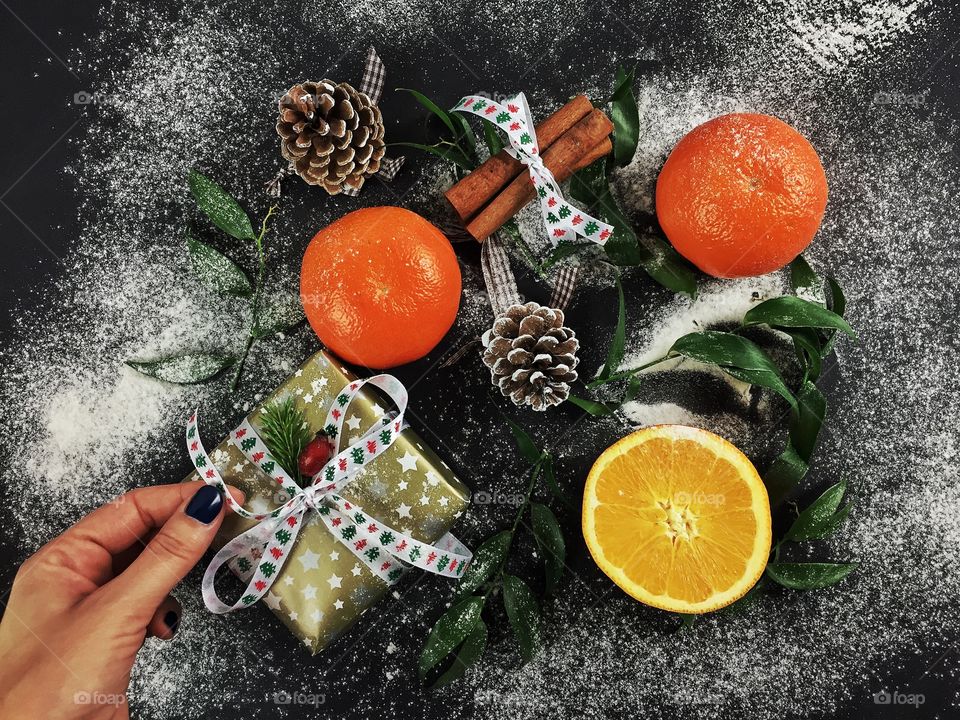 Woman hand holding christmas gift