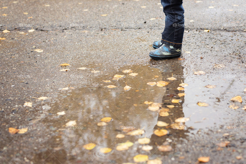Person standing near puddle