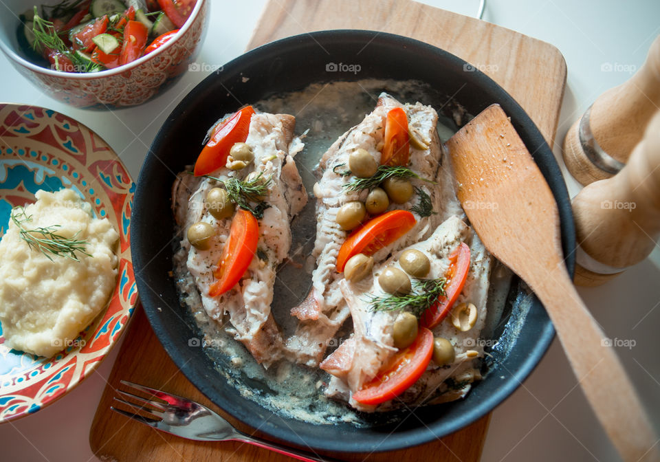 Dish with Sea bass fried with vegetables 