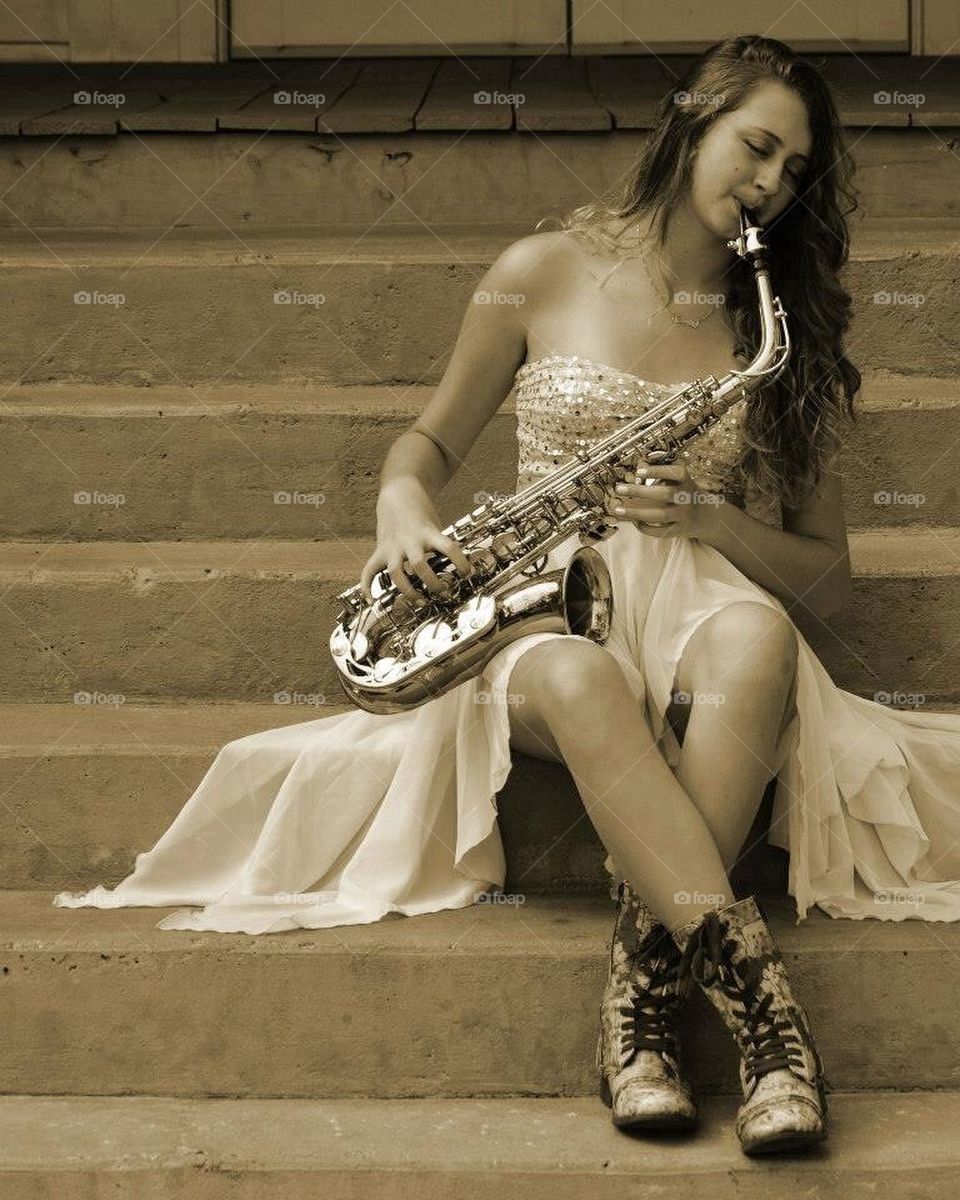 Young lady playing the sax