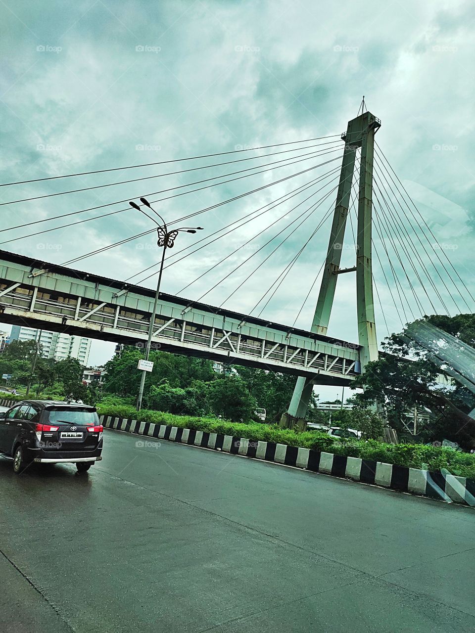 Cable Stayed Bridge

Rainy Weather ☔☁️
Highway Trip🛤️🛤️
👁️👁️📷👁️
Moving Vehicles 🚐🚛🛺