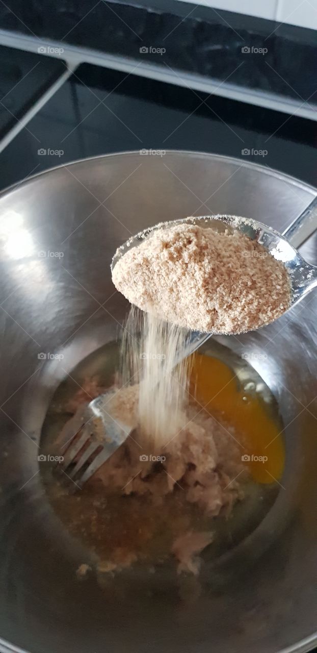 Spreading the breadcrumbs as per recipe