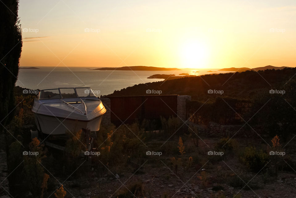 Boat in the backyard at sunset