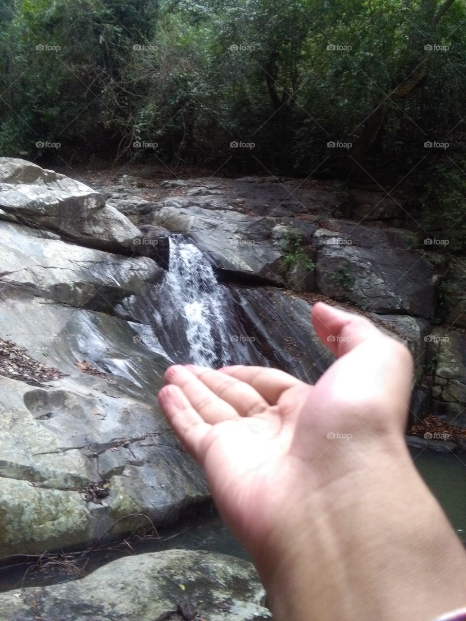 Waterfall with hand