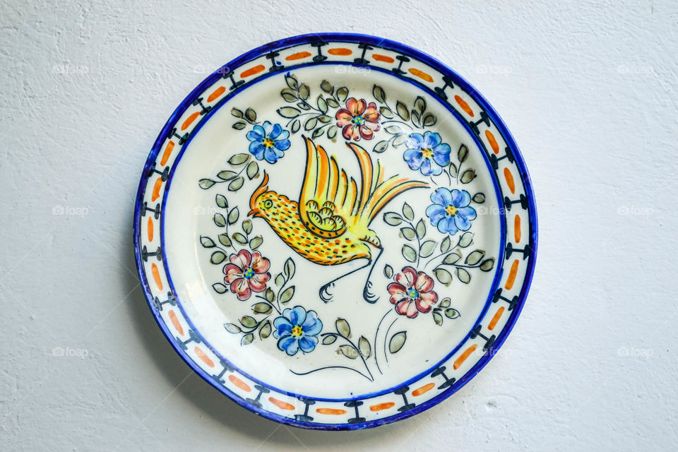 Hand painted plate on wall in Spain 